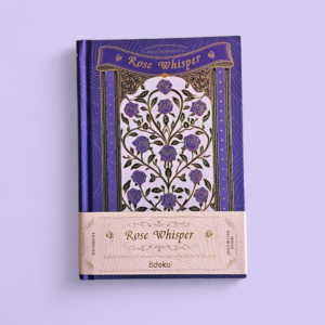 Libreta Cuaderno Rose Whisper de Ädeko. Diseño de pasta dura morada con un rosal ilustrado y detalles en foil dorado.